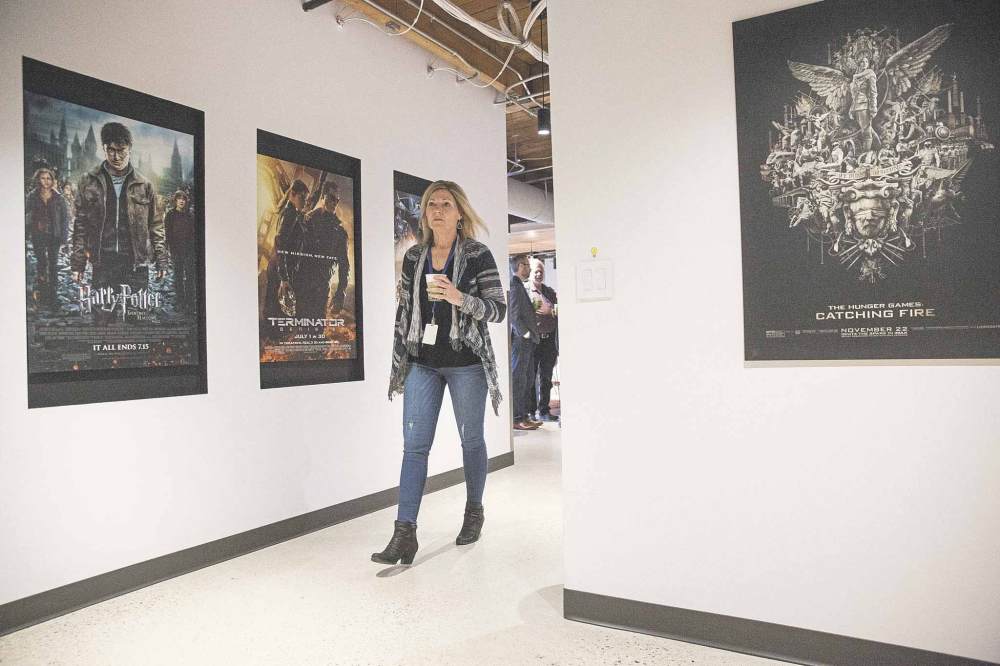 MIKE DEAL / WINNIPEG FREE PRESS  
Hanging on the walls in the new office space are posters for movies AWS was involved in helping to produce.