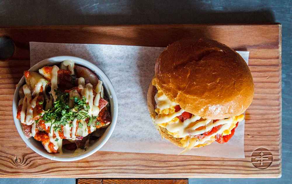 The popular Farmer Sausage sandwich along with a side of Garlic Roasted Breakfast Potatoes.