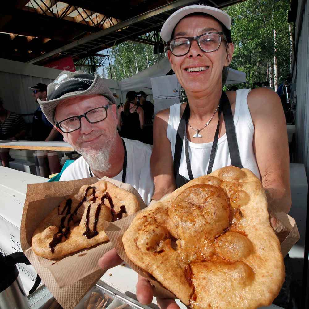 Sharon and Gary Doornsbosch show off the sweet and the savoury Whales Tails. (Phil Hossack / Winnipeg Free Press)