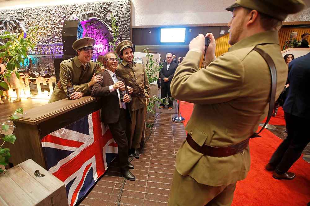 Bart Monaco poses for a photo with character actors at the red carpet screening of Stand! at the Centennial Concert Hall in Winnipeg on Tuesday. (John Woods / Winnipeg Free Press)