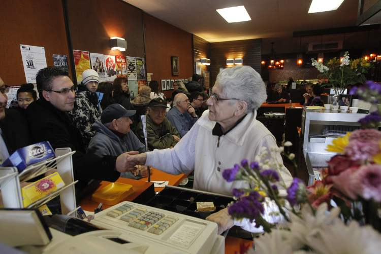 WAYNE GLOWACKI/WINNIPEG FREE PRESS
Longtime customer Dominic LaRosa shakes hands with Mary Kelekis.