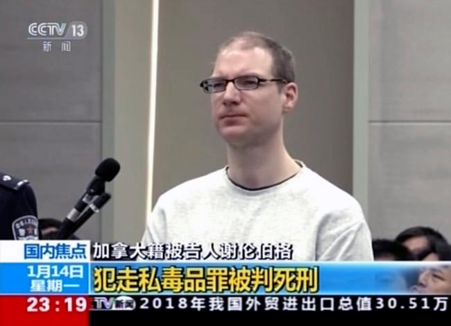 In this image taken from a video footage run by China's CCTV, Canadian Robert Lloyd Schellenberg attends his retrial at the Dalian Intermediate People's Court in Dalian, northeastern China's Liaoning province on Monday, Jan. 14, 2019. A Chinese court sentenced the Canadian man to death Monday in a sudden retrial in a drug smuggling case that is likely to escalate tensions between the countries over the arrest of a top Chinese technology executive. (CCTV via AP)