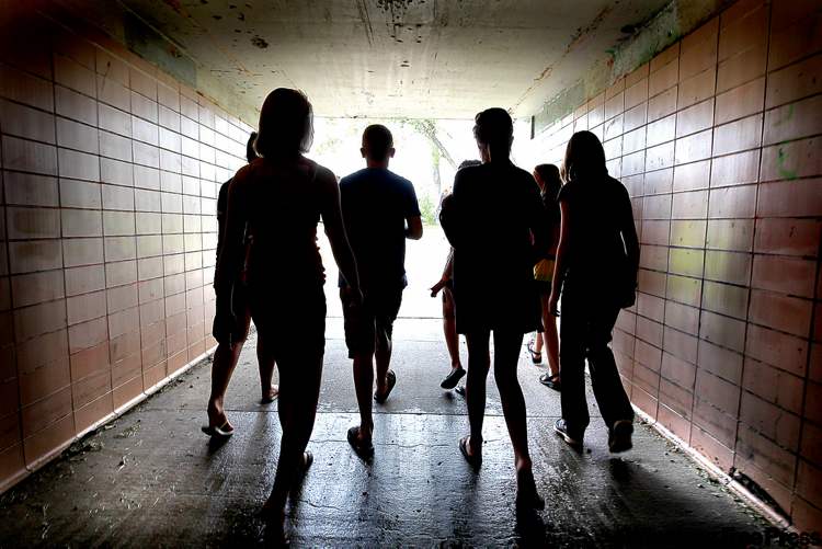 Grade six students at Windsor School walk through the tunnell under Dunkirk Drive on their way for ice cream at the BDI Thursday. It was their last day together in the same clasee as they finish elementary school and head into junior high � and separate classes in Grade 7 . Some of the students have been together in the same class since kindergarden class.
