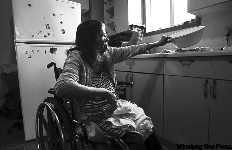 Joe Bryksa / Winnipeg Free Press
Rubena Harper, whose home has no running water, does her dishes by hand: 'There are others who are more critical than I am.'
