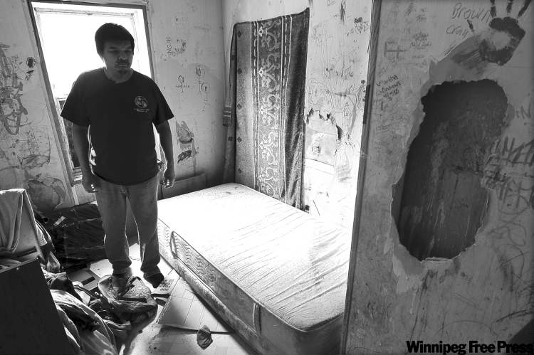 Richard Andrews in a bedroom in his decrepit trailer. Many residents of the reserve have to get by on 15 litres of treated water a day.