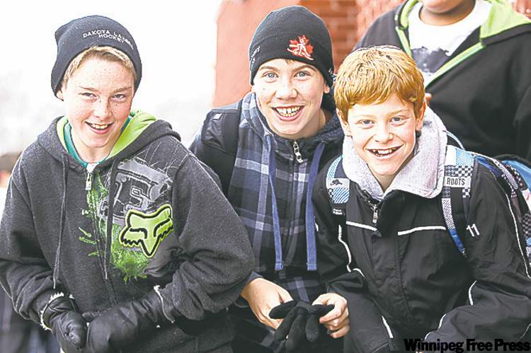 Jesse, Liam and Griffin (from left) goof around during their lunch break.