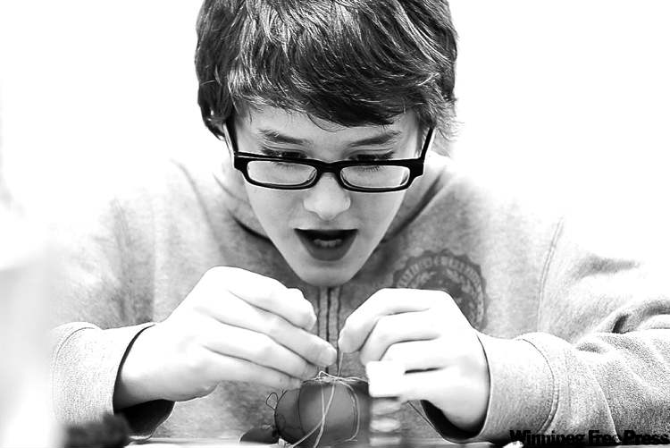 'None of the girls in our class are date-able as of now,' says Noah, here trying to thread a needle in his first sewing class.