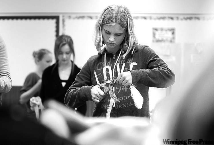 Naomi would rather concentrate on cutting out a pattern in sewing class than dating. 'I don't like thinking about that. It scares me.'