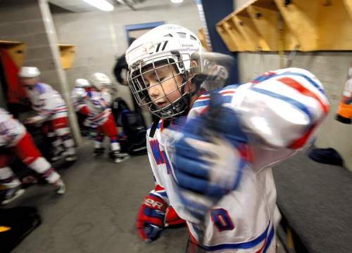 JOE BRYKSA / WINNIPEG FREE PRESS
Nine-year-old Daimon Gardner prepares to hit the ice with his teammates before his game in Warrod, Minnesota, earlier this week . He plays on the Warrod squirt a team.