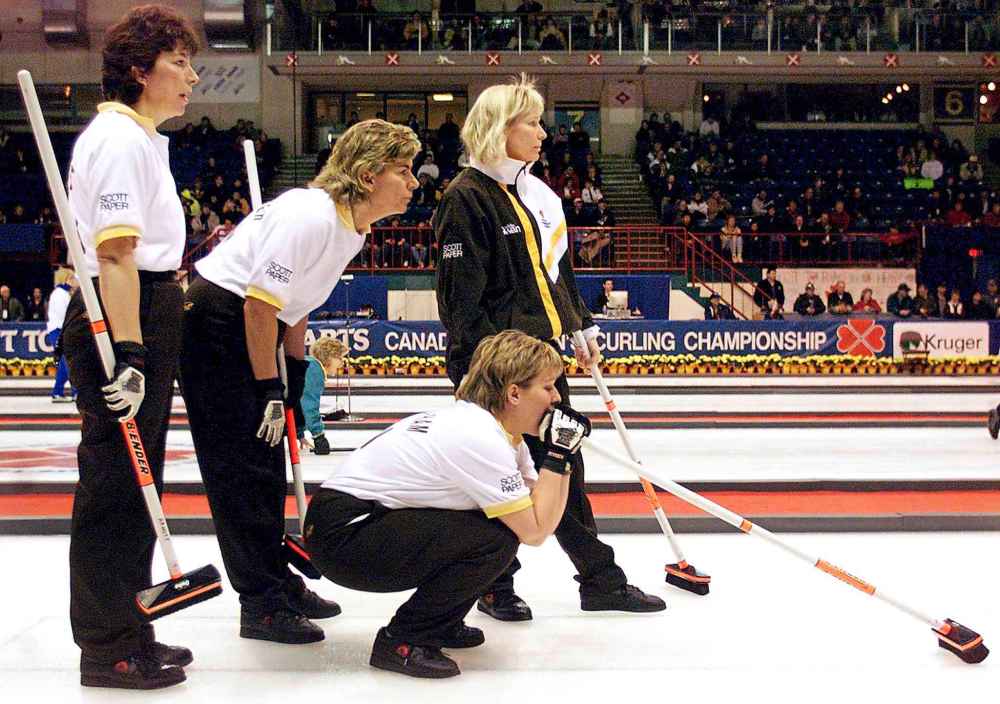 Chuck Stoody / The Canadian Press files
In Charlottetown in February 1999, Janet Arnott (left) was lead of the Manitoba rink that included Debbie Jones-Walker (second), Connie Lalibertie (skip) and Cathy Overton-Clapham (third, crouching) at the Scott Tournament of Hearts.