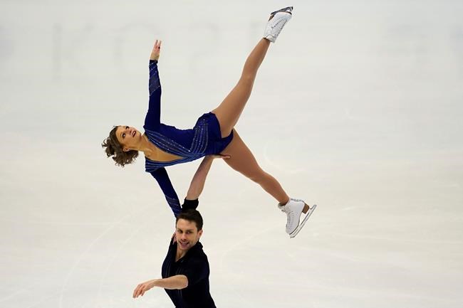 Kirsten Moore-Towers and Michael Marinaro of Canada perform in the pairs short program during the ISU Grand Prix of Figure Skating in Sapporo, northern Japan, Friday, Nov. 22, 2019. (AP Photo/Toru Hanai)