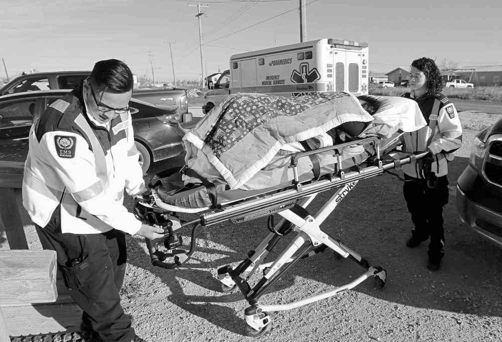 photos by JOE BRYKSA / WINNIPEG FREE PRESS
A bedridden Delia Chartier arrives at court Wednesday in Easterville, hoping her daughter Shelly Chartier would win her bid for house arrest at their Easterville home (below right). The judge decided otherwise.