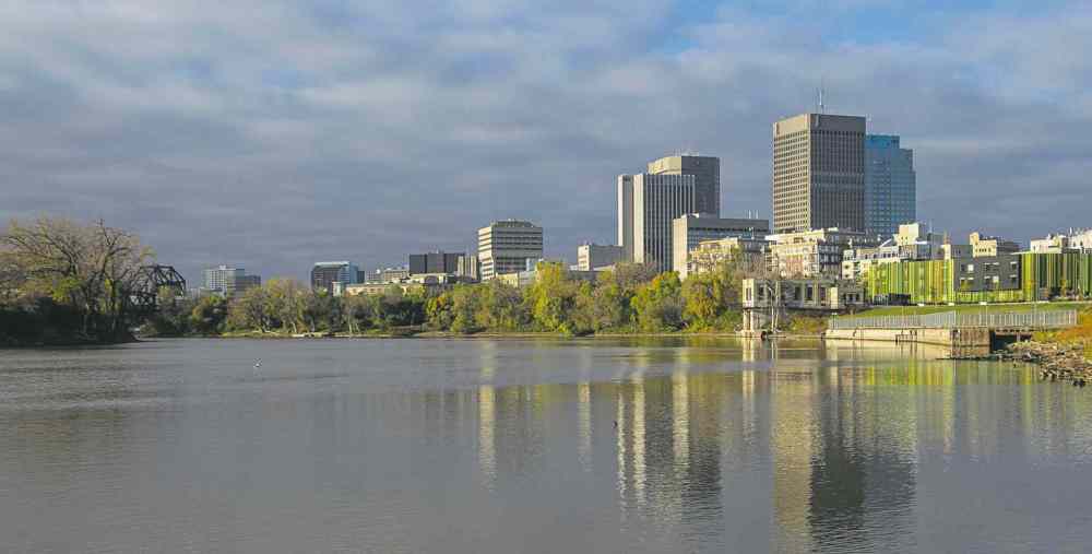 Downtown Winnipeg skyline as seen from the shore of the Red River along Waterfront Drive. (Mike Deal / Winnipeg Free Press files)