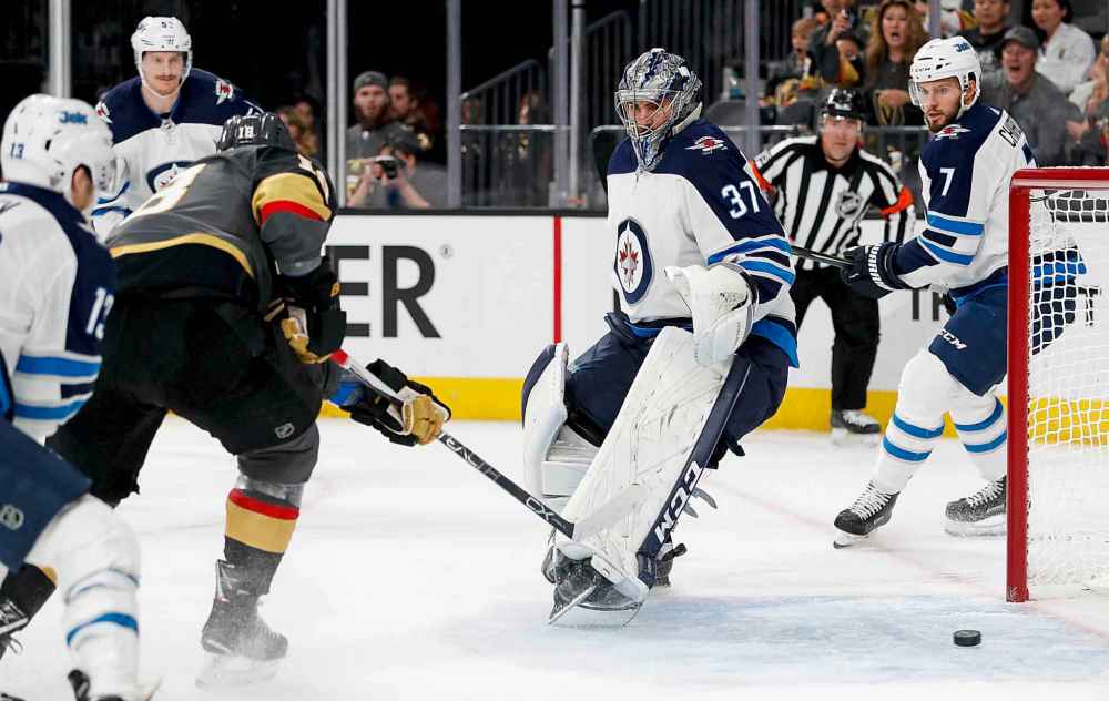 CP
Vegas Golden Knights left wing James Neal, left, scores past Winnipeg Jets goaltender Connor Hellebuyck during the second period.