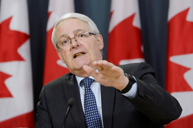Transport Minister Marc Garneau speaks about the grounding of all Boeing 737 Max 8 airplanes in Canada during a press conference in Ottawa on Wednesday, March 13, 2019. THE CANADIAN PRESS/Adrian Wyld