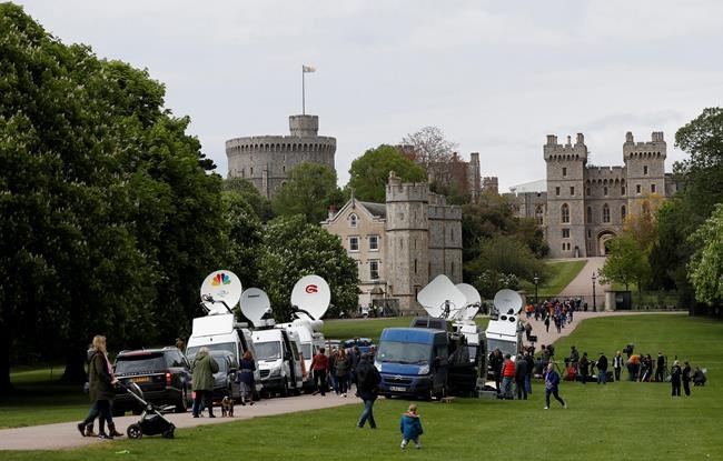 Members of the media gather outside Windsor Castle in south England on Monday after the announcement. (Alastair Grant / The Associated Press))