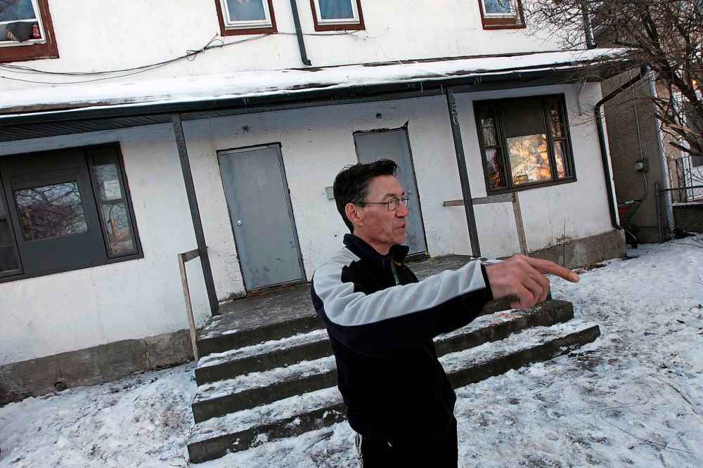 PHIL HOSSACK / WINNIPEG FREE PRESS
Vincent Lang outside a rooming house on Austin street that was the scene of an armed invasion, hostage taking and shooting, Wednesday.