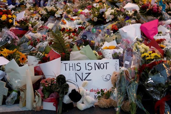 In this Saturday, March 16, 2019, file photo, flowers lay at a memorial near the Masjid Al Noor mosque for victims in last week's shooting in Christchurch, New Zealand. The leafy New Zealand city where a self-proclaimed racist fatally shot 50 people at mosques during Friday prayers is known for its picturesque meandering river and English heritage. For decades, the southern city of Christchurch also has been the center of the country's small but persistent white supremacist movement. (AP Photo/Vincent Yu, File)