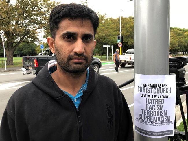 Yasir Amin, 35-year-old, describes his run-in with the gunman in Friday's mass shootings Saturday, March 16, 2019, in Christchurch, New Zealand. (AP Photo/Kristen Gelineau)