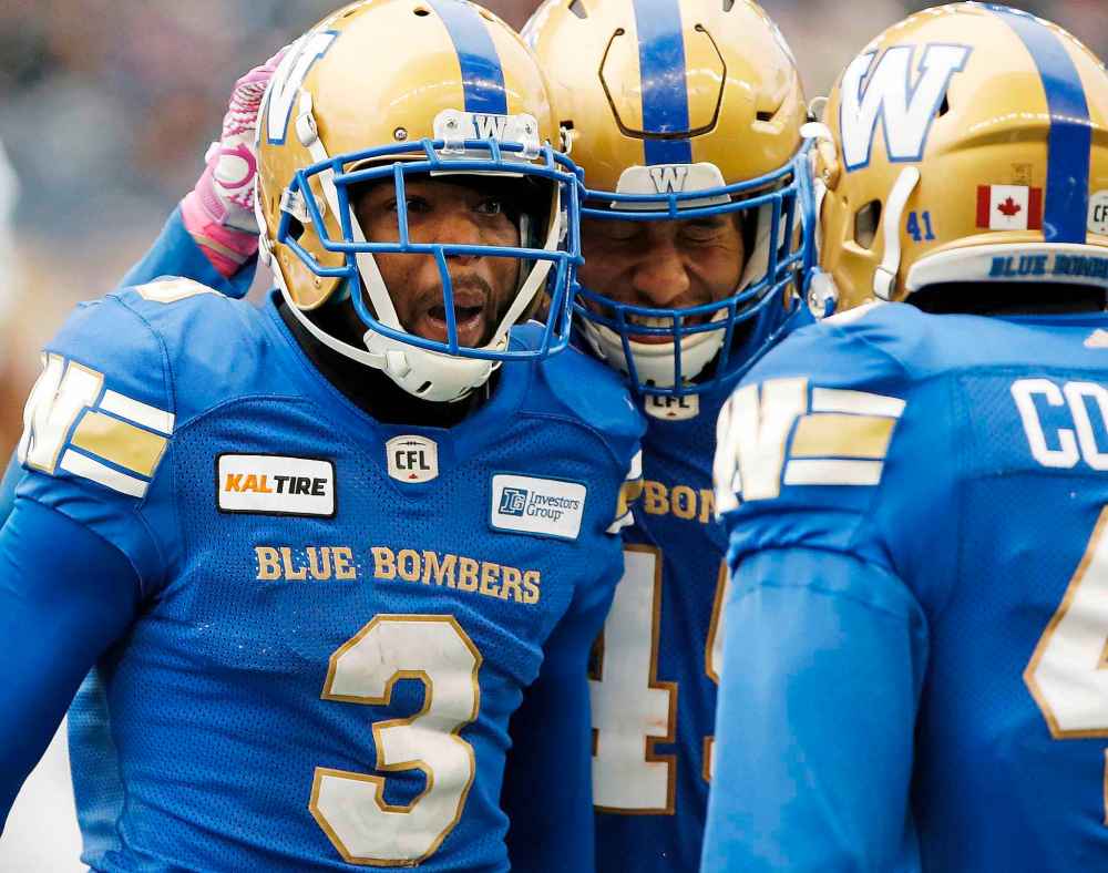 THE CANADIAN PRESS/John Woods
Winnipeg Blue Bombers' Kevin Fogg (3) celebrates his fumble recovery with Jovan Santos-Knox (45) during the second half of CFL action against the Saskatchewan Roughriders in Winnipeg Saturday, October 13, 2018.