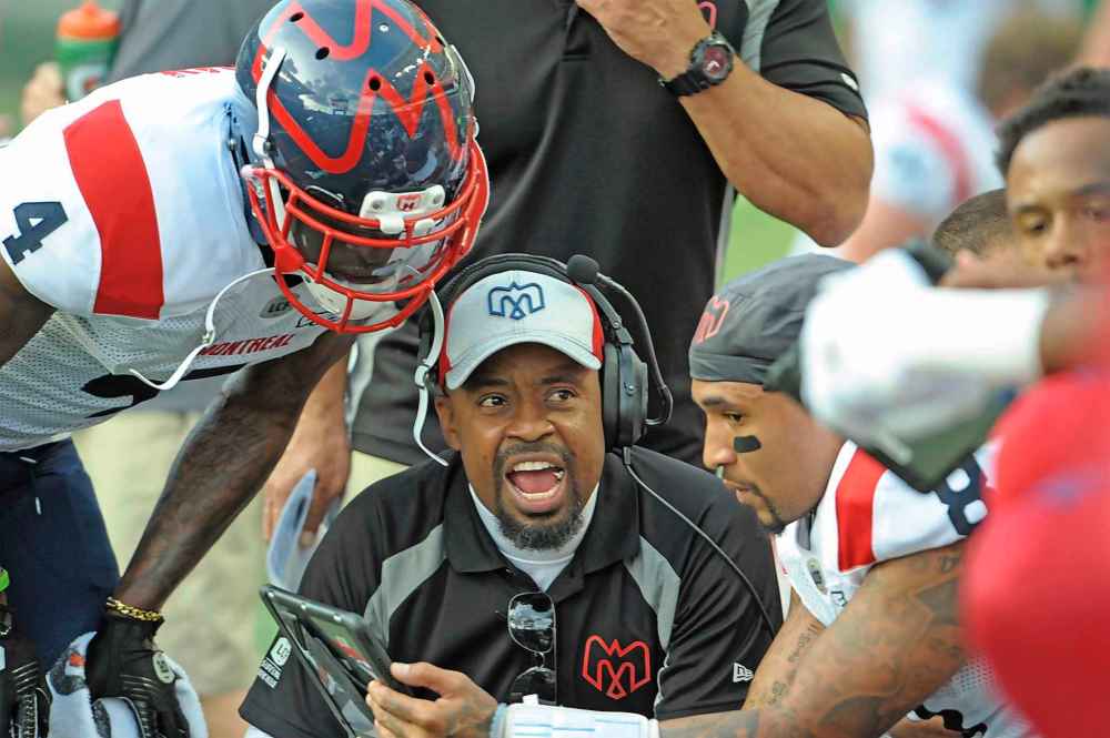THE CANADIAN PRESS/Mark Taylor
Rookie Montreal Alouettes head coach Khari Jones, centre, has his team on track to make the post-season.