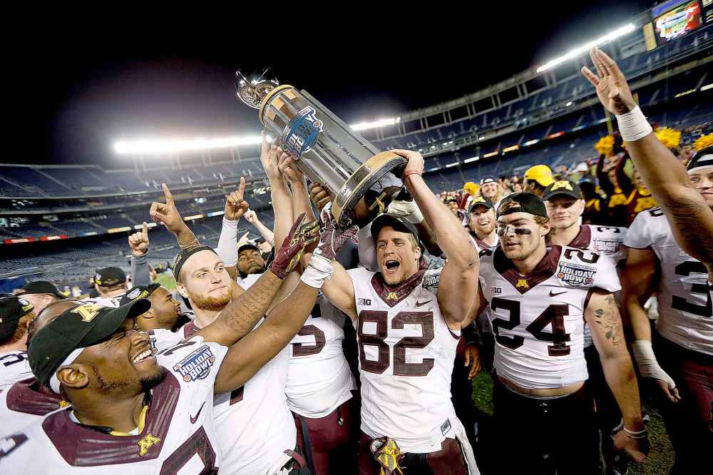 Elizabeth Flores / Minneapolis Star Tribune Files
Wolitarsky holds the Holiday Bowl trophy after his University of Minnesota Golden Gophers defeated Washington State in 2016. Wolitarsky says he didn't start watching game film until his junior year in college.