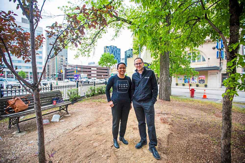 MIKAELA MACKENZIE / WINNIPEG FREE PRESS
Downtown Winnipeg BIZ spokesperson Tracey Umali (left) and True North SVP of Venues & Entertainment Kevin Donnelly in the future patio space in front of the Burton Cummings Theatre.