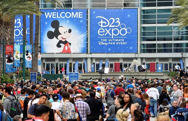 FILE - In this July 14, 2017, file photo a crowd of people wait to enter the D23 Expo as crews do interviews outside the Anaheim Convention Center in Anaheim, Calif. Members of Disney’s free D23 fan club were eligible to buy three years of Disney Plus service up front for the price of two years. (Jeff Gritchen/The Orange County Register via AP, File)