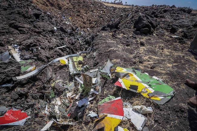 Wreckage lies at the scene of an Ethiopian Airlines flight that crashed shortly after takeoff at Hejere near Bishoftu, or Debre Zeit, some 50 kilometers (31 miles) south of Addis Ababa, in Ethiopia Sunday, March 10, 2019. The Ethiopian Airlines flight crashed shortly after takeoff from Ethiopia's capital on Sunday morning, killing all 157 on board, authorities said, including 18 Canadians. THE CANADIAN PRESS/AP
