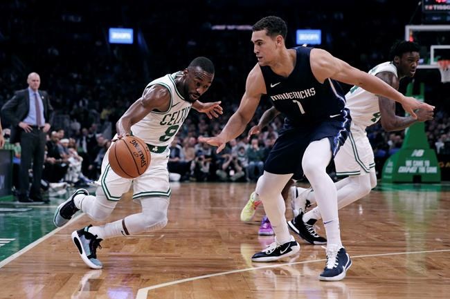Boston Celtics guard Kemba Walker (8) drives to the basket against Dallas Mavericks forward Dwight Powell (7) during the first quarter of an NBA basketball game in Boston on November 11, 2019. Dwight Powell is ready to play for Canada on home soil. The Dallas Mavericks forward indicated on Saturday that he would play for Canada when Victoria hosts an Olympic qualifying tournament in June. Canada missed out on qualifying in China in September in part because only two NBAers -- Sacramento's Cory Joseph and Orlando's Khem Birch -- suited up for the national team. THE CANADIAN PRESS/AP, Charles Krupa