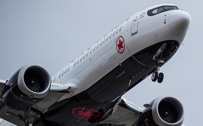 An Air Canada Boeing 737 Max aircraft arriving from Toronto prepares to land at Vancouver International Airport in Richmond, B.C., on March 12, 2019. Boeing's share price has dropped more than 11 per cent -- a loss of more than US$26.6 billion -- since the plane maker's 737 Max 8 fatally crashed Sunday, but Canada's two largest airlines have emerged nearly unscathed. Air Canada and WestJet Airlines Ltd. saw their stocks decline about 3.4 per cent and 2.5 per cent, respectively, since the Ethiopian Airlines disaster that killed all 157 people on board. THE CANADIAN PRESS/Darryl Dyck