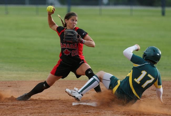 Australia's Leigh Godfrey (17) is forced out at second base by Canada's Natalie Wideman in the fifth inning of the World Cup of Softball tournament game for third place in Oklahoma City on July 14, 2013. When softball player and Olympic 2022 hopeful Natalie Wideman was handed a cheque and told the money came from women she did not know, she was speechless.