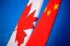 Flags of Canada and China are placed for the first China-Canada economic and financial strategy dialogue in Beijing, China, Monday, Nov. 12, 2018. A Canadian man convicted of drug trafficking in China faces the possibility of more serious charges after a court ordered a new trial amid tensions over Canada's arrest of a Chinese technology executive. THE CANADIAN PRESS/Jason Lee/Pool Photo via AP