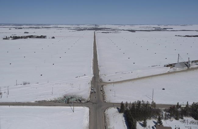The wreckage of a fatal crash outside of Tisdale, Sask., is seen Saturday, April, 7, 2018. The coroner in Saskatchewan has completed its investigation into the Humboldt Broncos crash that killed 16 people and injured 13 on the junior hockey team's bus last April. It has made six recommendations. THE CANADIAN PRESS/Jonathan Hayward