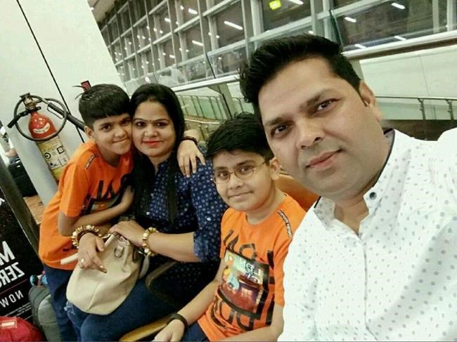 Ram Nivash Misra, right to left, Shreyaan Mishra, 10, Anupam Tripathi and Aarav Mishra, nine, are shown in this undated handout photo. THE CANADIAN PRESS/HO
