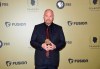 Executive producer Louis CK poses with the award for