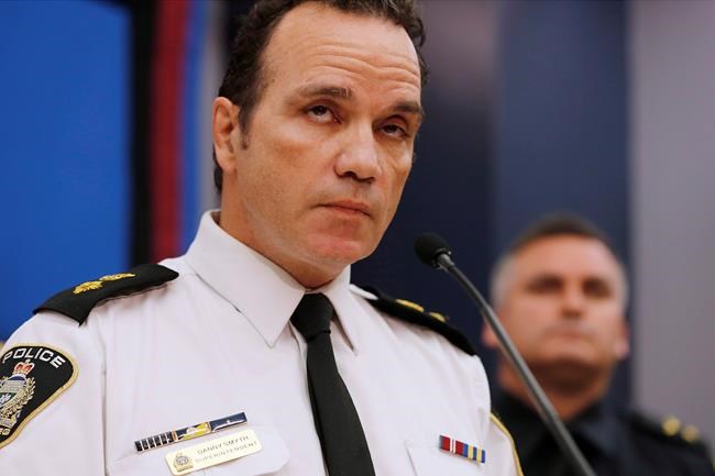 The chief of the Winnipeg Police Service says he may have to cut staff due to a budget shortfall amid a spike in violence and property crimes. Winnipeg Police Superintendent Danny Smyth speaks at a press conference in Winnipeg, Wednesday, Nov. 12, 2014. THE CANADIAN PRESS/John Woods