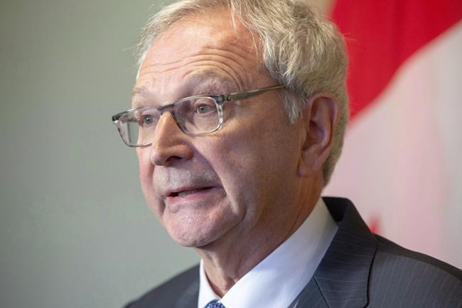 New Brunswick Progressive Conservative Leader Blaine Higgs answers questions from the media at Government House in Fredericton on Friday, Nov. 2, 2018. The premier of New Brunswick says the level of transfer payments to the provinces could be at risk if a pipeline isn't built to move western crude to Eastern Canada and foreign markets. THE CANADIAN PRESS/James West