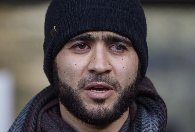 Omar Khadr speaks outside court in Edmonton on Thursday, December 13, 2018. An Alberta judge is expected to rule today on whether a war crimes sentence for former Guantanamo Bay prisoner Khadr should be declared expired.THE CANADIAN PRESS/Jason Franson