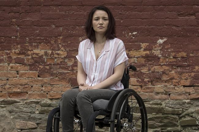 Danielle Kane, a shooting survivor from the Danforth attack, poses for a photograph at Liberty Village Park in Toronto on Friday, July 12, 2019. As the RCMP remains tightlipped about why two young men may have gone on a murder spree in northern British Columbia, one of the victims in Toronto's Danforth shooting says she's been following the story closely. THE CANADIAN PRESS/Tijana Martin