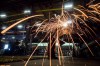 A man uses a grinder on a steel stairs being manufactured for a high school in Redmond, Wash., at George Third & Son Steel Fabricators and Erectors, in Burnaby, B.C., on Thursday March 29, 2018. American automakers, aluminum producers, manufacturers and farmers are running out of time, money and patience as the North American tariff standoff persists, and they're pleading with the United States to put an end to it. THE CANADIAN PRESS/Darryl Dyck