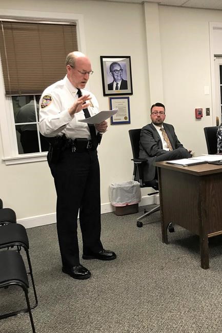 FILE - In this Nov. 14, 2018 file photo, East Hampton, Conn., Police Chief Dennis Woessner addresses the Town Council in East Hampton. East Hampton officer Kevin P. Wilcox, has retired from the force after Committee for Civil Rights Under Law raised concerns about his membership with the Proud Boys, a far-right group known for engaging in violent clashes at political rallies. In September, Woessner told the civil rights organization that Wilcox’s Proud Boys membership didn’t violate department policies. (Jeff Mill/The Middletown Press via AP)