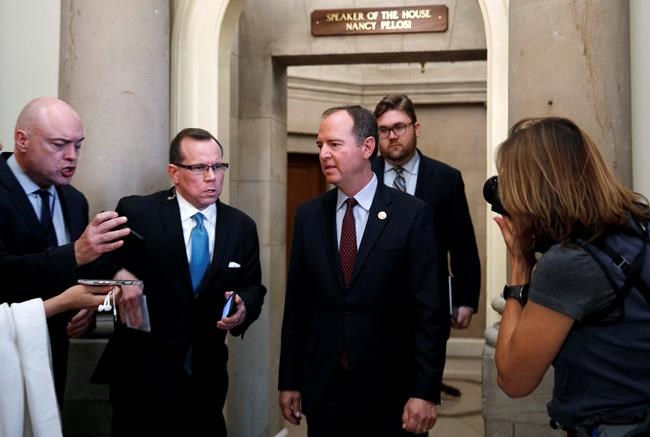 Rep. Adam Schiff, D-Calif., Chairman of the House Intelligence Committee, center, leaves a meeting with House Speaker Nancy Pelosi of Calif., before a closed door caucus meeting about impeachment, Tuesday Sept. 24, 2019, on Capitol Hill in Washington. (AP Photo/Jacquelyn Martin)