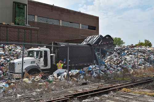 TESSA VANDERHART / WINNIPEG FREE PRESSMountains of recyclable materials are mounded behind Emterra Environmental on Henry Avenue in Winnipeg, Aug. 15, 2019.