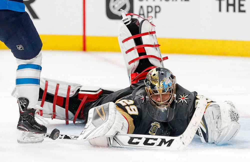 (AP Photo/John Locher)
Vegas Golden Knights goaltender Marc-Andre Fleury makes a save against the Jets during the third period Wednesday.