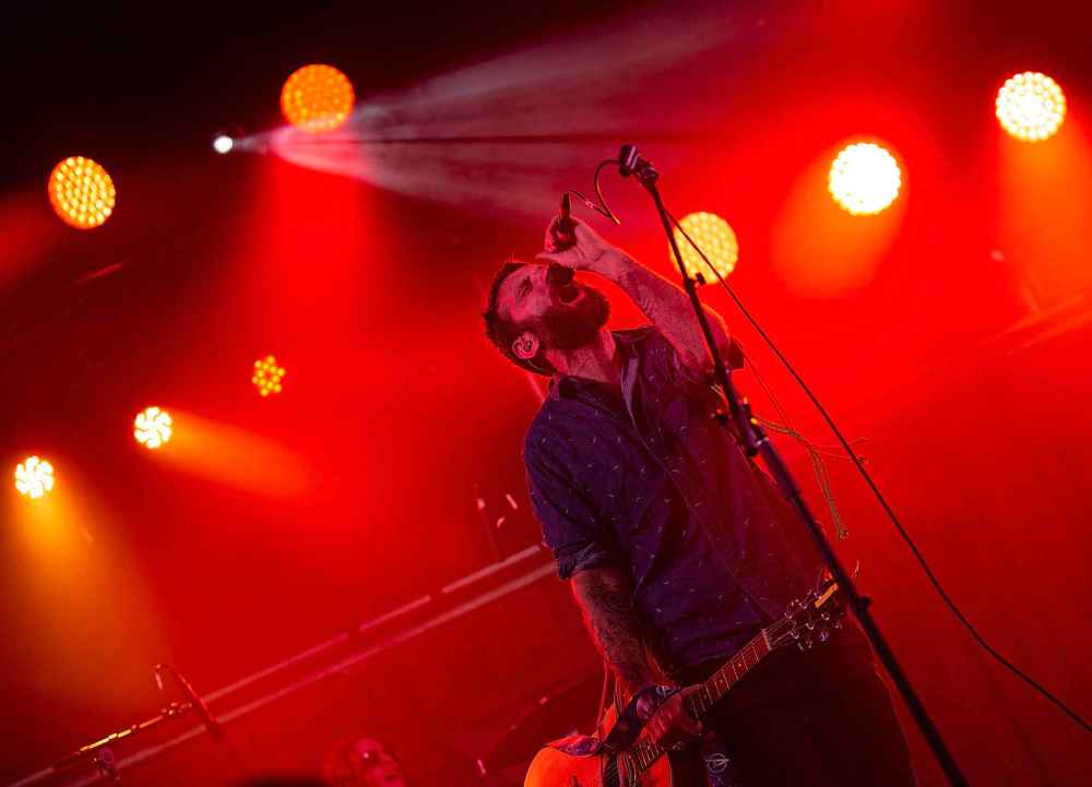 ANDREW RYAN / WINNIPEG FREE PRESS
Simon Ward and Ontario indie-folk-rock group The Strumbellas, the Folk Festival's Friday night headliner, left in all on the stage in front of a packed audience.