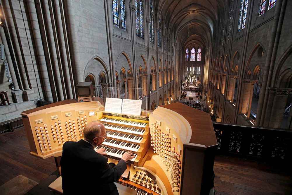 Philippe Lefebvre plays the organ at Notre Dame cathedral in Paris in 2013. (Christophe Ena / The Associated Press files)