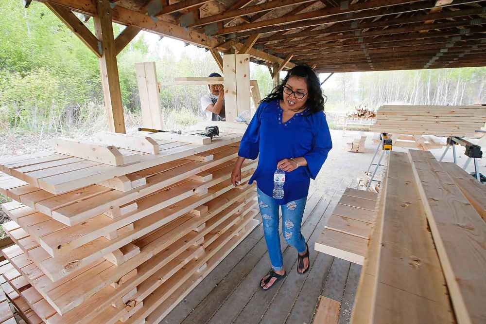 CP
Roxanne Greene, councillor for Shoal Lake 40 First Nation, checks some of the new 40 picnic tables being built for an upcoming community celebration of the completion of Freedom Road.