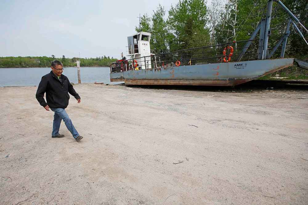CP
Chief Erwin Redsky walks past the old ferry the community used to get to the mainland.
