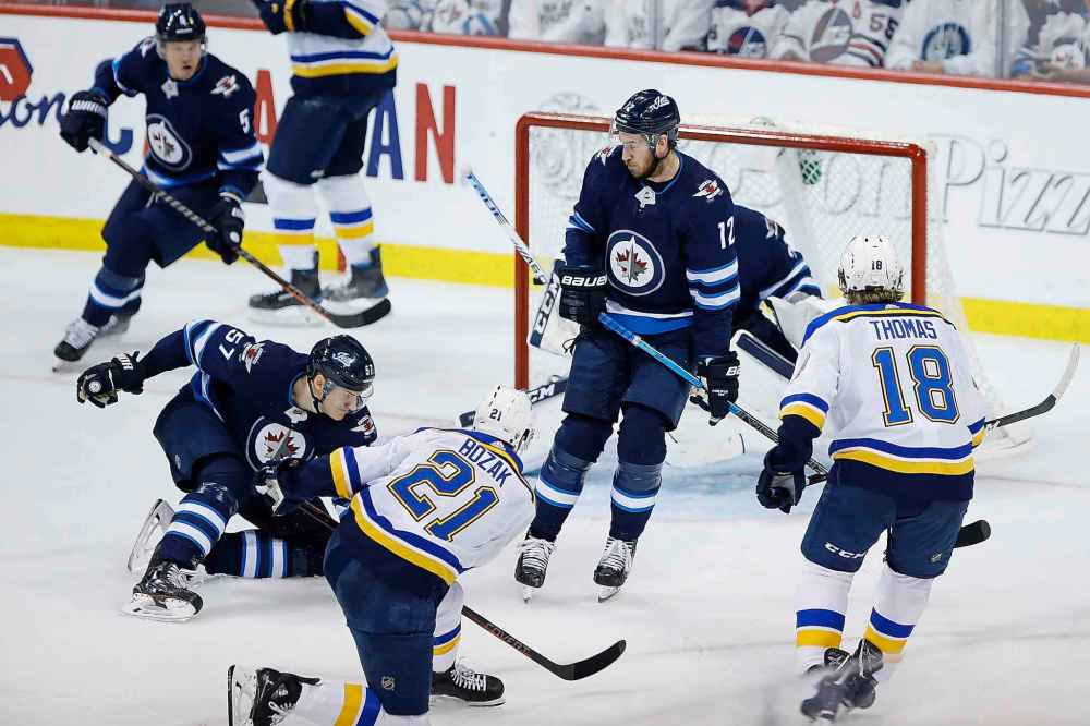 THE CANADIAN PRESS/John Woods
St. Louis Blues centre Tyler Bozak scores the game-winning goal past Kevin Hayes, centre, during the third period on Wednesday.